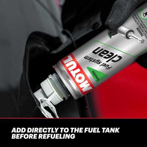 Motul Fuel System Clean Auto 300 mL being added to a fuel tank