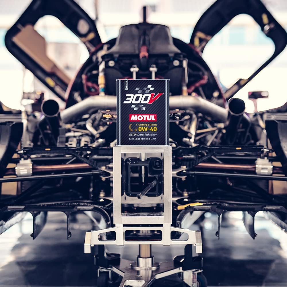 Motul 300V Competition 0W-40 2L beside an open engine bay