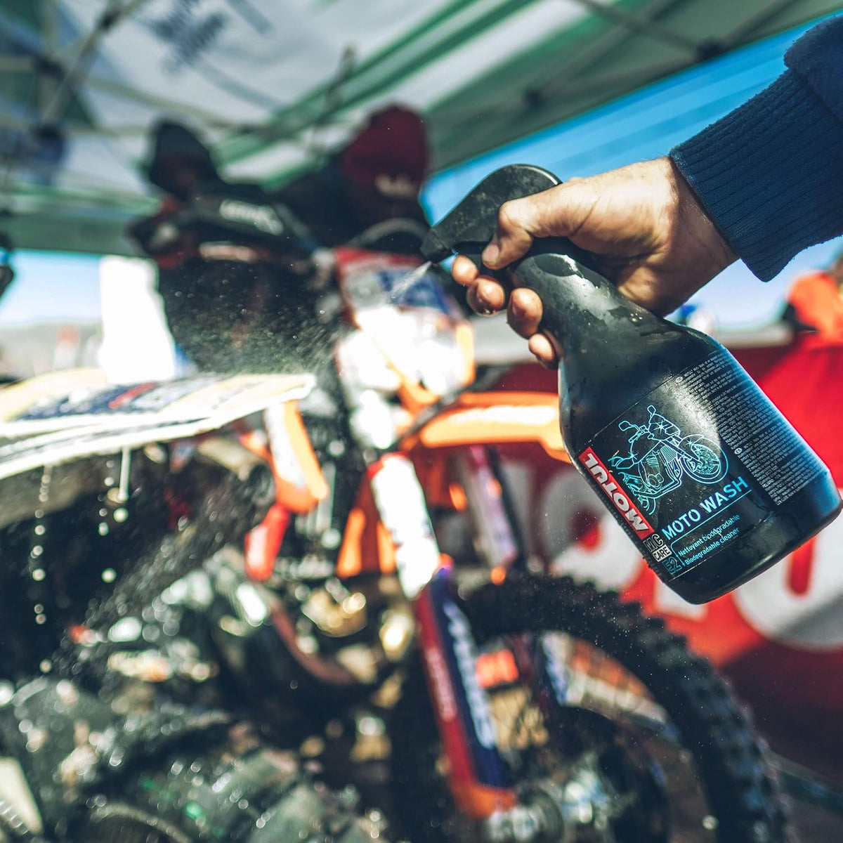 Motul E2 Moto Wash 1L sprayed onto a dirt bike