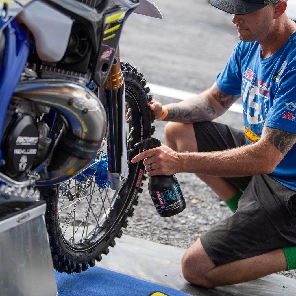 Motul E2 Moto Wash 1L used while cleaning a dirt-bike wheel